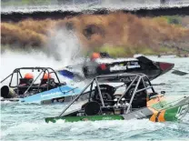  ??  ?? In a haze of jet fumes . . . Turbinepow­ered jetboats prepare to start the second leg of yesterday’s action of the New Zealand Jet Boat marathon. From front to back are the boats driven by: John Derry, Mike Pooley and Roger Preston.