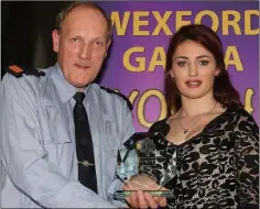  ??  ?? Kathlyn Furlong, Ballyhogue, receives her award from Inspector Pat McDonald.