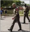  ?? ?? Texas Department of
Public Safety Director Steven McCraw walks along the street outside Robb Elementary School in Uvalde, Texas, Monday, May 30, 2022.