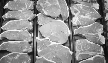  ??  ?? Beef sirloin steaks are displayed behind the meat counter a grocery store in Knoxville, Tennessee, in this 2014 photo. — WP-Bloomberg photo