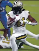  ?? BRETT DUKE – THE ASSOCIATED PRESS ?? The Saints’ Alvin Kamara tied an NFL mark by rushing for six touchdowns on Dec. 25.