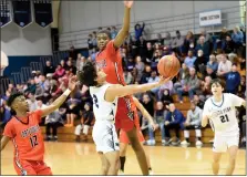  ?? MIKE CABREY — MEDIANEWS GROUP ?? North Penn’s Mario Sgro goes up for a shot as Coatesvill­e’s Lawrence Brown looks for a block during their District 1-6A second-round game on Feb. 21.