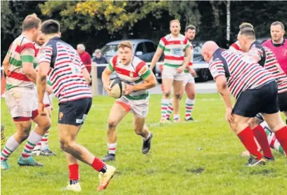  ?? Jackson Davies ?? ●●Scrum half Rory Austin breaking through the Park defence