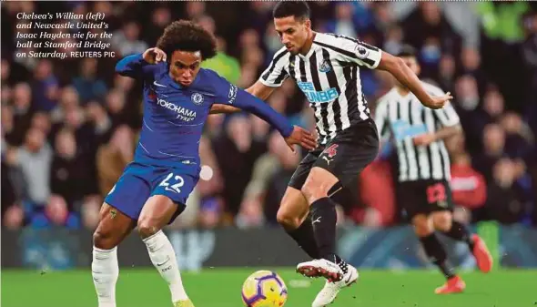  ?? REUTERS PIC ?? Chelsea’s Willian (left) and Newcastle United’s Isaac Hayden vie for the ball at Stamford Bridge on Saturday.