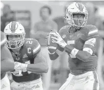  ?? MICHAEL LAUGHLIN/SUN SENTINEL ?? Redshirt freshman quarterbac­k N’Kosi Perry led three touchdown drives during Miami’s 77-0 win over Savannah State on Saturday night.