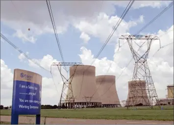  ?? PHOTO: BLOOMBERG ?? Power lines and cooling towers are seen at Eskom’s Kendal coal-fired power station in Delmas, Mpumalanga. The utility is being advised on how to best manage outages by US firm Black & Veatch, which seeks to grow its business in sub-Saharan Africa.