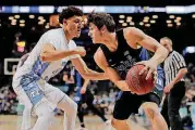  ?? [AP PHOTO] ?? In this March 10, 2017, file photo, Duke guard Grayson Allen looks to drive against North Carolina forward Justin Jackson during the semifinals of the Atlantic Coast Conference tournament in New York. Duke begins the 2017-18 season as the top-ranked...