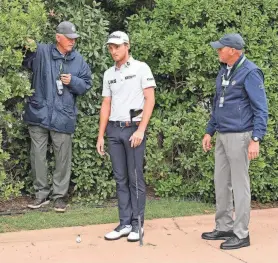  ?? GETTY IMAGES ?? Will Zalatoris talks with a rules official on the sixth hole Sunday during the final round of the PGA Championsh­ip at Southern Hills.