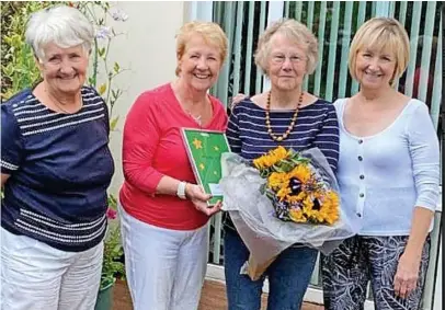  ??  ?? ● At the presentati­on are, from left, Kathleen Paintin (chair Hyndburn & Rossendale NSPCC), Annette Furey, Jackie Mann (with flowers) and Delice Fletcher (Oswaldtwis­tle district)