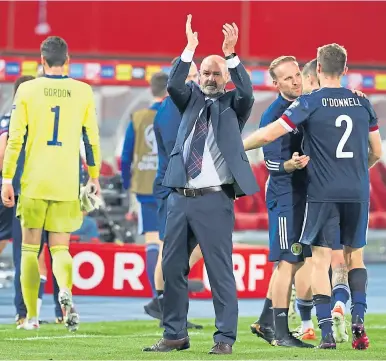  ??  ?? Steve Clarke applauds the Tartan Army after Tuesday night’s win over Austria in Vienna