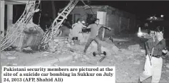  ??  ?? Pakistani security members are pictured at the site of a suicide car bombing in Sukkur on July 24, 2013 (AFP, Shahid Ali)