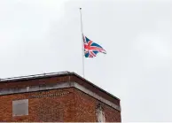  ??  ?? The flag at the town hall was flown at half mast yesterday in memory of Captain Sir Tom Moore.