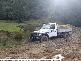  ??  ?? The muddy exit from the river was too much for the AT tyres until aired down further.