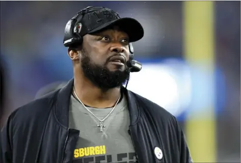  ?? AP FILE PHOTO/GAIL BURTON ?? In this 2019 file photo, Pittsburgh Steelers head coach Mike Tomlin looks on during the first half of an NFL football game against the Baltimore Ravens in Baltimore.