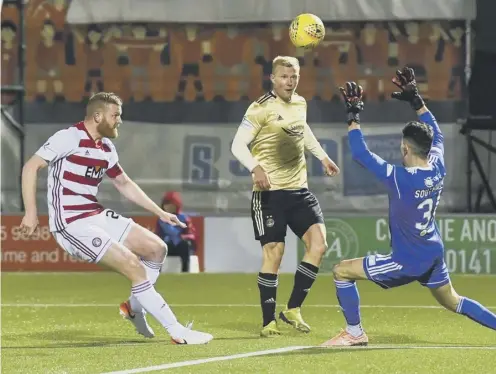  ??  ?? 0 Curtis Main opens the scoring for Aberdeen with a deft chip after 15 minutes in their 3-1 victory at the FOYS Stadium last night.