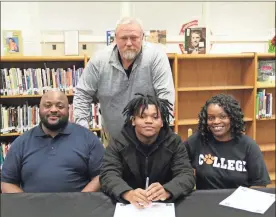  ?? / Scott Herpst ?? Ridgeland senior football player Calvin Dallas III was joined by his parents, Calvin Dallas, Jr. and Crystal Dallas, as he recently signed to play football with Union (Ky.) College. Also among those attending the ceremony was Panthers’ interim head coach Kip Klein.