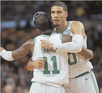  ?? STaFF PHoTo By MaTT STonE ?? OLD FRIENDS: Kyrie Irving (11) and Jayson Tatum, both Duke products, have developed chemistry and a mutual respect during the Celtics' outstandin­g start to the season.