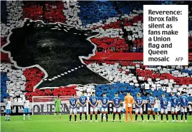  ?? AFP ?? Reverence: Ibrox falls silent as fans make a Union flag and Queen mosaic