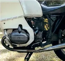  ??  ?? BELOW RIGHT: There's no faffing with the switchgear of the R100T, it's simple and functional
– unlike its much younger brother.