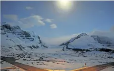  ?? THE CANADIAN PRESS FILES ?? The Athabasca Glacier, centre, part of the Columbia Icefields in Jasper National Park, Alta., is seen in moonlight during a long exposure.