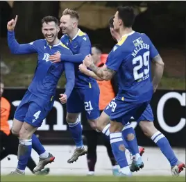  ?? ?? Jamie McCart (left) is mobbed after scoring the winner in Perth