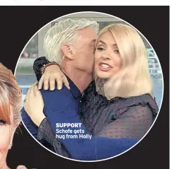  ??  ?? SUPPORT
Schofe gets hug from Holly