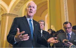  ?? J. SCOTT APPLEWHITE/THE ASSOCIATED PRESS ?? John Cornyn, R-Texas, joined at right by Sen. Roy Blunt, R-Mo., rear, answers a question about the mass shooting at a Texas church this week, during a news conference Tuesday on Capitol Hill in Washington.