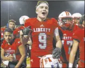  ?? Erik Verduzco Las Vegas Review-Journal ?? Liberty High’s Ikalewa Paaoao (31), Moliki Matavao (9), Ryan Jones (77) and Edward Gastelum (4) celebrate their upset Friday of Bishop Gorman.