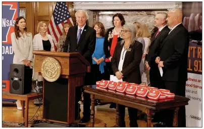  ?? Arkansas Democrat-Gazette/JOHN SYKES JR. ?? With naloxone kits on the table beside him, Gov. Asa Hutchinson says Tuesday at a Capitol news conference that in the opioid crisis, “the priority has to be in saving lives first.” More photos are available at arkansason­line.com/626narcank­its/