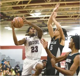  ?? PAUL W. GILLESPIE/CAPITAL GAZETTE ?? Broadneck’s Kyle Miles gets fouled by Meade’s Lucaya Baldridge as he goes up for a shot during the second quarter of Wednesday’s game.