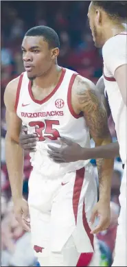  ?? NWA Democrat-Gazette/CHARLIE KAIJO ?? Arkansas Razorbacks forward Reggie Chaney reacts after a score during a basketball game on Feb. 16 at Bud Walton Arena in Fayettevil­le.