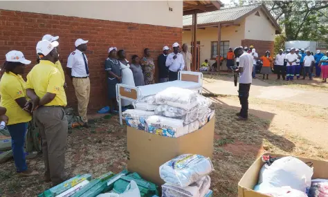  ??  ?? Expectant mothers receive donations including wrapping cloths popularly known as “Zambias” (top picture)