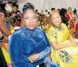  ?? ?? Audrey Reid (left), stage and screen actress, and Mary Isaacs, recording artiste, await their turn to receive their acknowledg­ements as QORIHC Queens at the seventh staging of the event held at the Karl Hendrickso­n Auditorium, Jamaica College on Sunday.