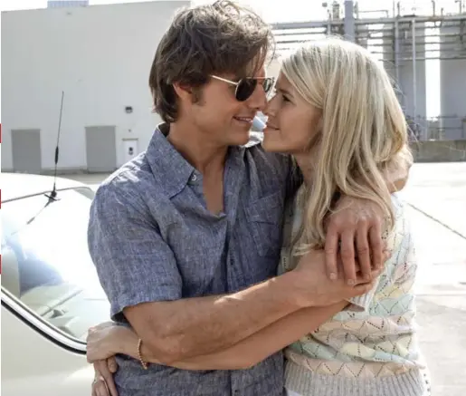  ?? DAVID JAMES/UNIVERSAL PICTURES VIA THE ASSOCIATED PRESS ?? Tom Cruise and Sarah Wright star as Barry Seal, a dumb, cocky and reckless flying ace, and Lucy, his untrusting yet devoted wife, in American Made.