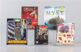  ?? EVYN MORGAN/THE STRONG NATIONAL MUSEUM OF PLAY VIA AP ?? From left, Asteriods, Ultima I, Resident Evil, Myst, and SimCity, the 2024 inductees into the World Video Game Hall of Fame, are displayed Thursday at the museum.