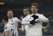  ?? MOLLY DARLINGTON — THE ASSOCIATED PRESS FILE ?? Leeds United’s Patrick Bamford, right, celebrates with teammates after scoring his side’s opening goal from penalty during an English Premier League match against Burnley in Leeds, England, on Dec. 27.