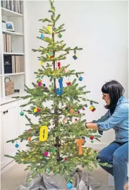  ?? [PROVIDED/JENNIFER LUTZ] ?? Jennifer Lutz, of Hillsdale, Mich., decorated a Christmas tree for her four kids, ages 11 to 14, this year the day after Halloween. She put up the rest of her holiday decor, including two more trees, the following week. “It gives us something to look forward to,” she said.