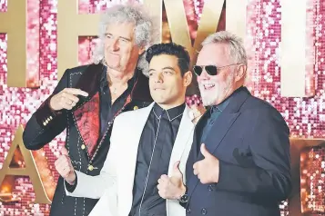  ??  ?? Brian May (lead guitarist of Queen), Rami Malek and Roger Taylor (drummer) attend the World Premiere of ‘Bohemian Rhapsody’ in London.