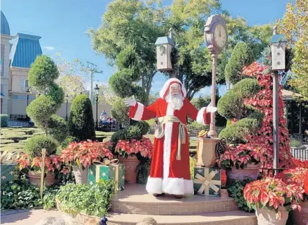  ?? KATHLEEN CHRISTIANS­EN/ORLANDO SENTINEL ?? Père Noël makes appearance­s in the France Pavilion throughout Festival of the Holidays at Epcot.