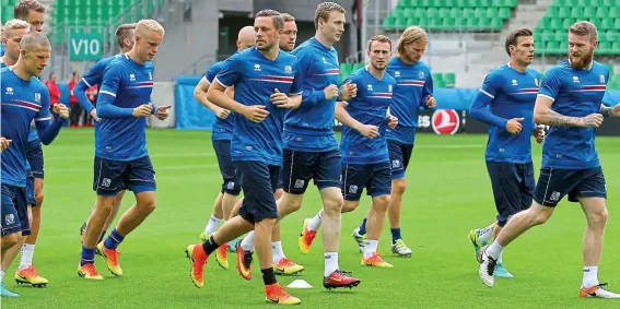  ?? EPA ?? Marvel men: Iceland’s players are put through their paces in training ahead of their opening clash against Portugal tonight