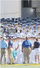  ?? MATTHEW COLE/CAPITAL GAZETTE ?? The Brigade of Midshipmen, seen marching onto the field before a game against Cincinnati at Navy-Marine Corps Memorial Stadium in 2017, will be allowed to attend Saturday’s home game against Temple.