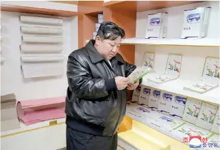  ?? KOREA NEWS SERVICE PHOTO VIA AFP KCNA/ ?? READ MY MIND
North Korea’s leader Kim Jong Un looks at published material during his inspection of a factory in Kimhwa County of southern Kangwon province on Wednesday, Feb. 7, 2024.