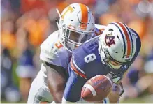  ?? PHOTO BY PATRICK MURPHY-RACEY ?? Tennessee defensive end Kyle Phillips sacks Auburn quarterbac­k Jarrett Stidham during the visiting Vols’ upset of the 21st-ranked Tigers this past October. Stidham fumbled on the play, with Alontae Taylor returning it for a touchdown.