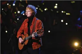  ?? YUI MOK/WPA POOL/GETTY IMAGES/TNS ?? Ed Sheeran performs onstage during the first Earthshot Prize awards ceremony at Alexandra Palace Oct. 17, 2021, in London.
