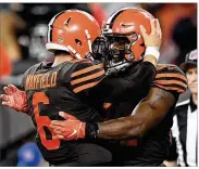  ?? JASON MILLER/GETTY IMAGES ?? Browns running back Carlos Hyde celebrates a touchdown with newly installed starting quarterbac­k Baker Mayfield last Thursday.