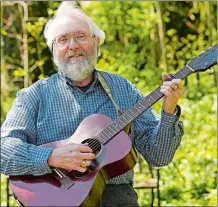  ?? SEAN D. ELLIOT/THE DAY ?? Former State Troubadour Tom Callinan poses for a photo Tuesday, at his Norwich home. He has penned a new song, “The Home-Sick Blues,” about life in coronaviru­s lockdown.