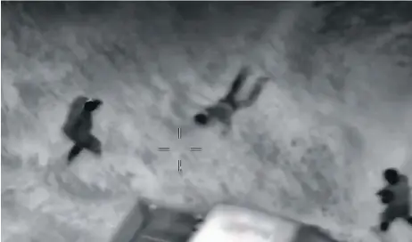  ?? SUPPLIED/POSTMEDIA ?? A screen shot of infrared video shows the capture of Douglas Garland on a farm near Airdrie, Alta., north of Calgary, in 2014. Garland is accused of murdering three people and dismemberi­ng and burning their bodies on the property, where he lived with...