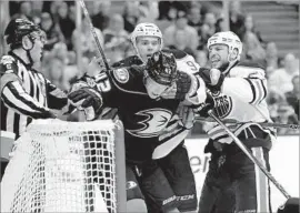  ?? Sean M. Haffey Getty Images ?? JOSH MANSON, getting pushed by Edmonton’s Connor McDavid, center, and Milan Lucic in Game 2 of playoff series, will try to help the Ducks rebound.