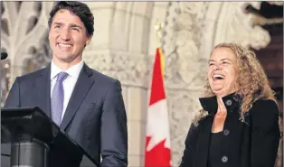  ?? CP PHOTO ?? Prime Minister Justin Trudeau shares a laugh with former astronaut, and Governor General designate, Julie Payette, on Parliament Hill in Ottawa July 13.