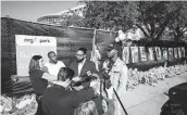  ?? Jon Shapley / Staff photograph­er ?? Samuel Bush, second from left, and Jackson Bush, right, say they received no training to work security.